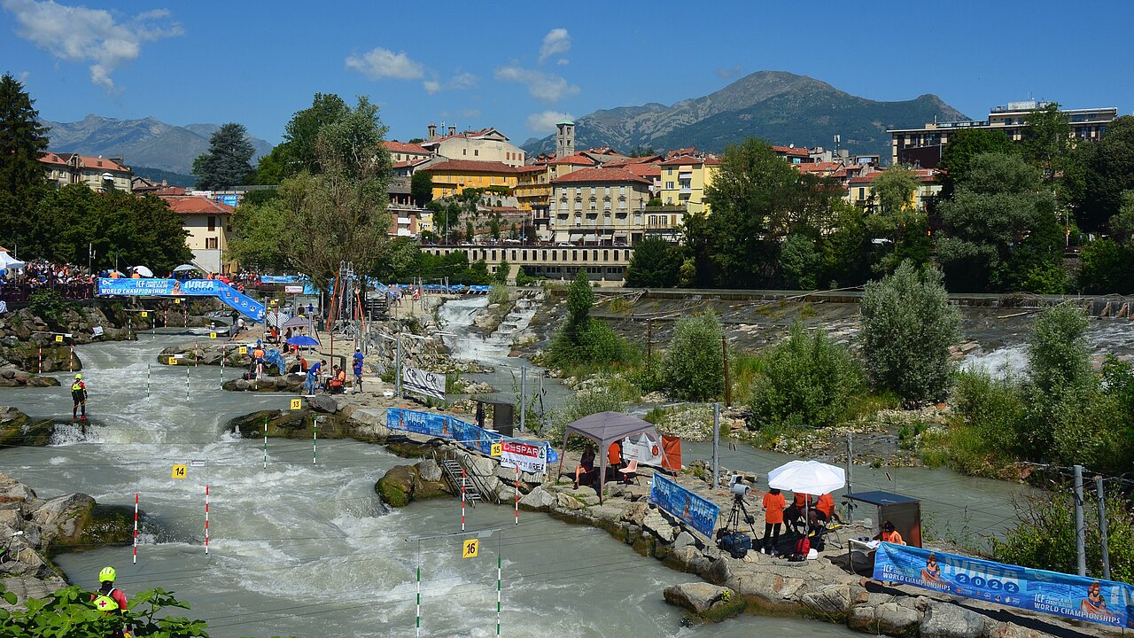 The canoe track of Ivrea in the background blue sky and the city with mountains.