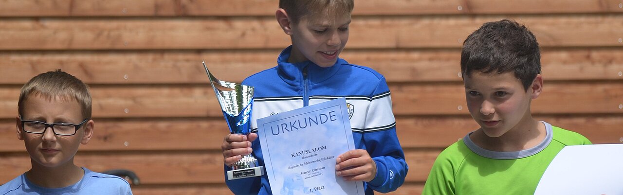Little Christian with cup and certificate on the podium in Rosenheim 2017